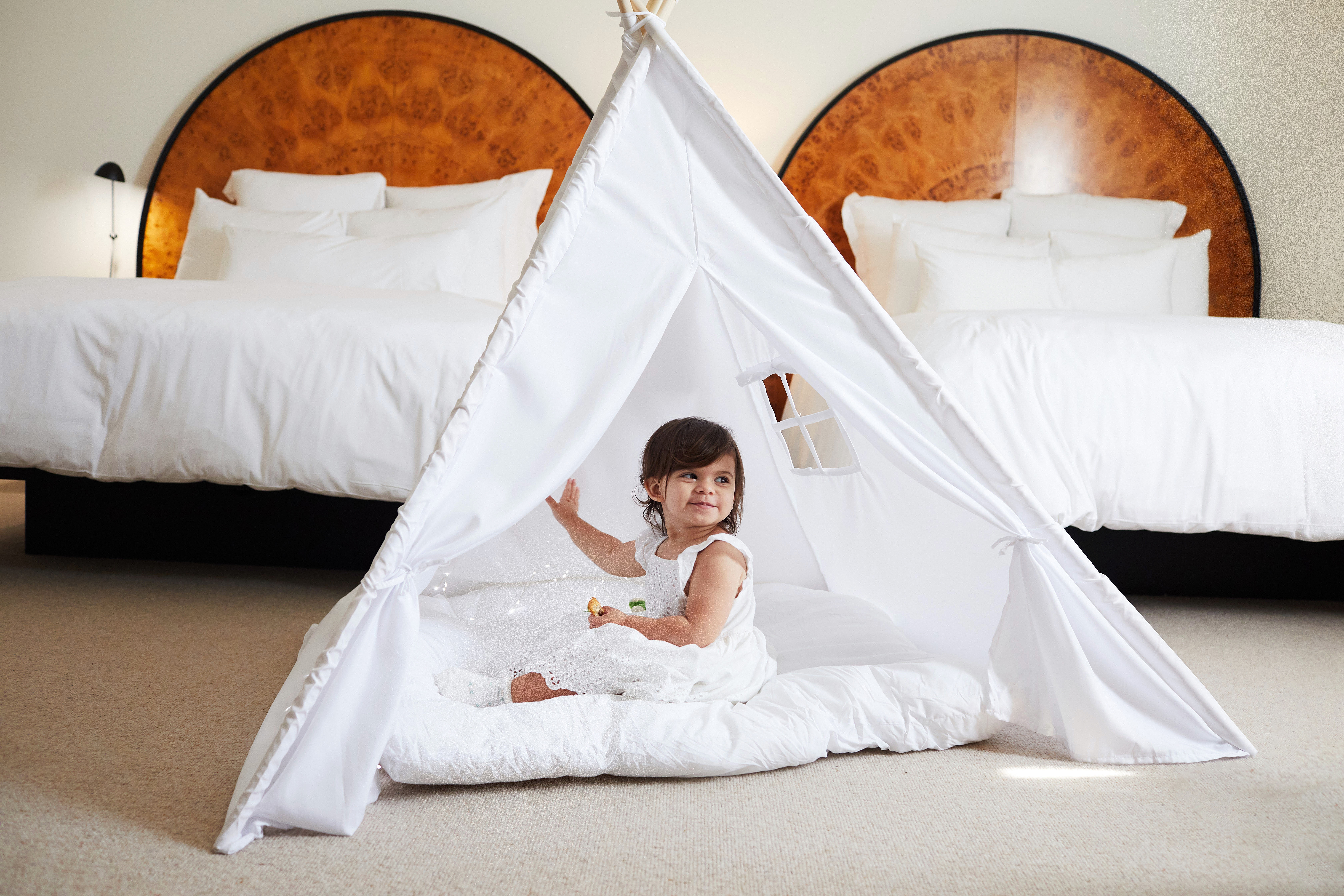 Young child with play tent