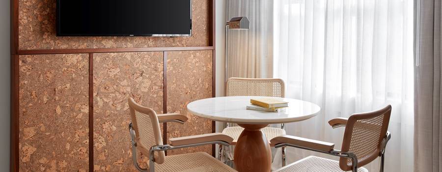 Detail of table and chairs in window of bedroom