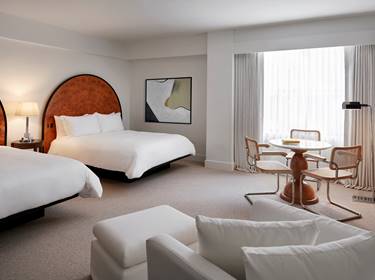 View of entire Deluxe Double Queen room at Lyle.