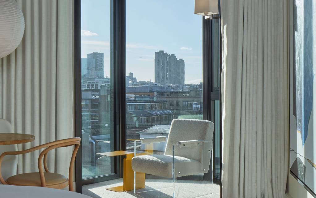 Chair next to window in guestroom at One Hundred Shoreditch, London
