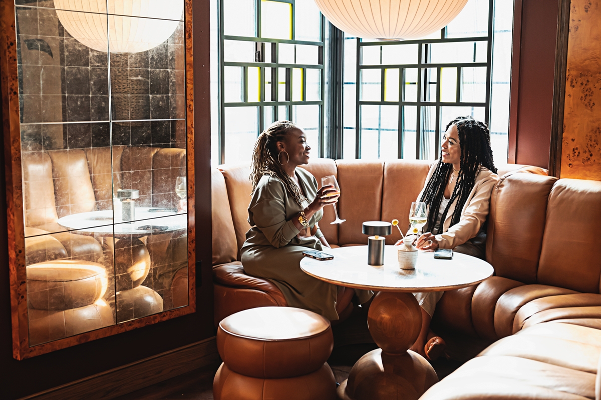 Two women drinking wine at Lyle's Restaurant and Bar