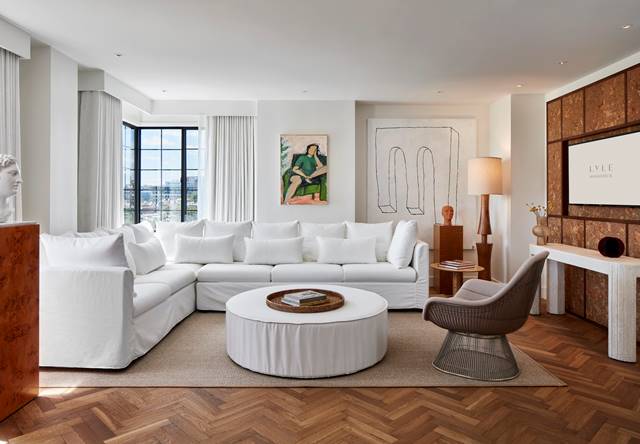 Lyle Suite living area with white sofa and coffee table