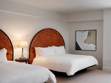 Deluxe Double Queen beds with art on wall